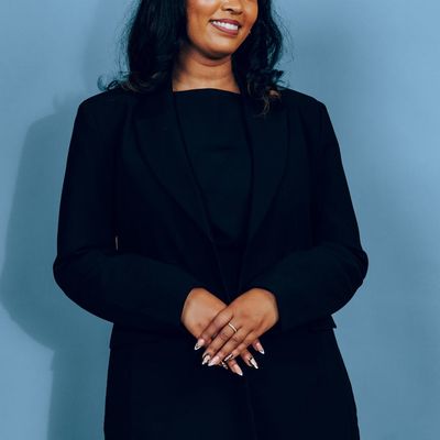 Confident businesswoman with dark hair in professional attire